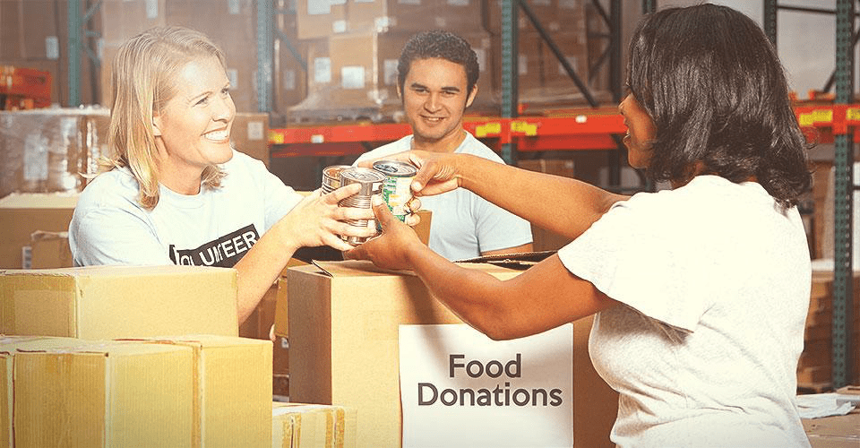 Food donations neatly organized in a warehouse, ready to be distributed to those in need.
