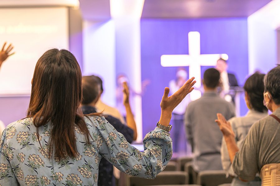 Church Insurance - People Praising at Church